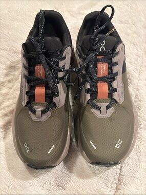 On Running Women’s Trail Sneakers in Olive with Black and Orange Accents